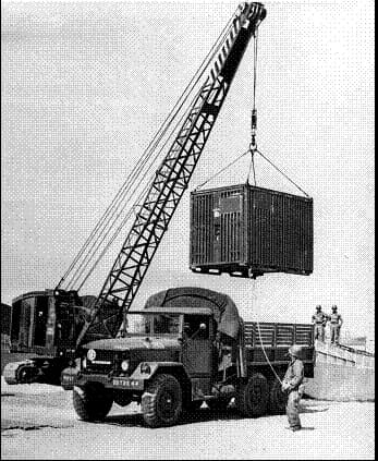 Historical photo of a military crane loading a CONEX box in the 1950s